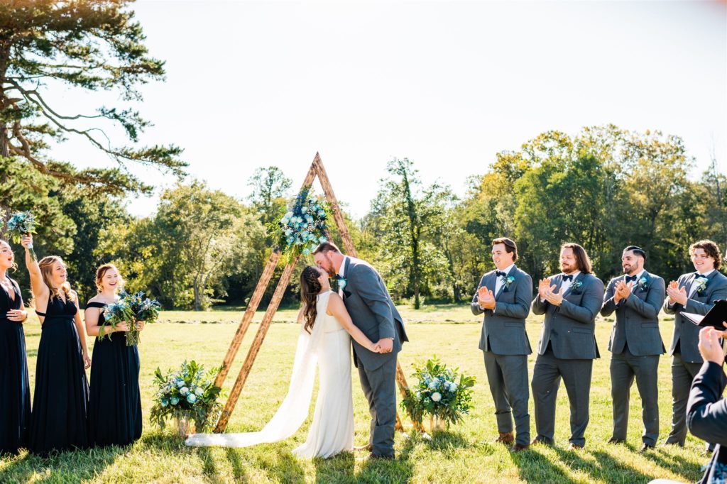 Charlottesville wedding photographer captures bride and groom kissing at their outdoor ceremony for their Shenandoah wedding with Charlottesville wedding photographer  
