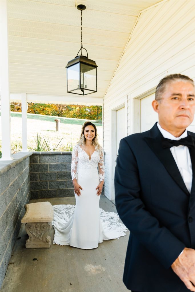 Charlottesville wedding photographer captures bride walking to her father for a daddy daughter first look outside of the Shenandoah wedding venue 