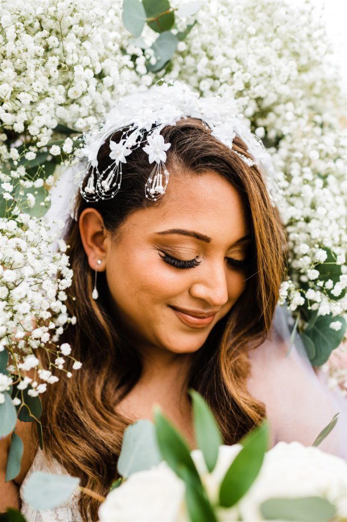 Charlottesville wedding photographer captures bridal photos with florals surrounding the brides face