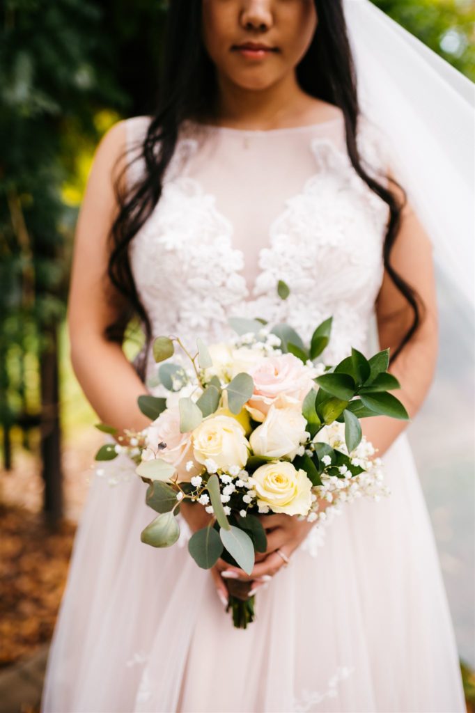 bride holding a small rose wedding bouquet for her outdoor Shenandoah wedding with Charlottesville wedding photographer