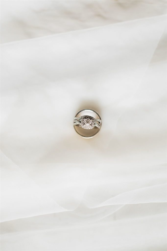 engagement ring and wedding band sitting together on a white surface for Shenadoah wedding 